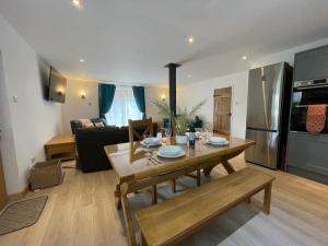 a kitchen and living room with a table and a couch at Wonderful Property with Parking and a walk into Bakewell in Bakewell