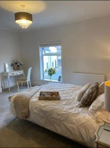 a bedroom with a bed with a tray on it at Sea view Cottage in Cleethorpes