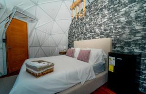 Кровать или кровати в номере Ovalulú Glamping Hotel