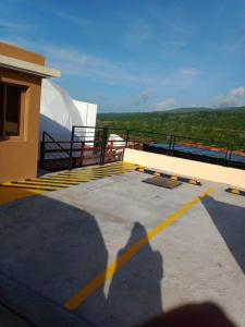 a shadow of a person standing on top of a building at Ovalulú Glamping Hotel in Santa Cruz de Barahona