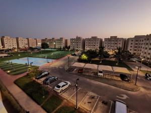 an aerial view of a parking lot in a city at بيوت أدار - Adar Homes in King Abdullah Economic City