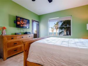a bedroom with a large bed and a window at Beachfront San Felipe Villa 721 in San Felipe +23 photos
