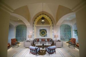 a large living room with a couch and chairs at Steigenberger Alcazar in Sharm El Sheikh