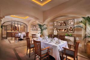 a dining room with a table and chairs in it at Steigenberger Alcazar in Sharm El Sheikh