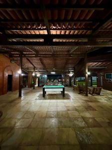 a pool table in the middle of a room at Casa de Praia - Prainha in Aquiraz