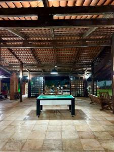 a pool table in the middle of a room at Casa de Praia - Prainha in Aquiraz