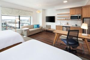 a hotel room with a bed and a desk at Element Minneapolis Downtown North Loop in Minneapolis