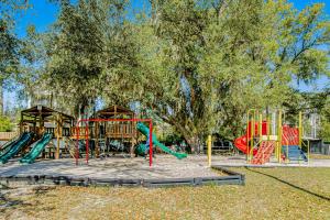a park with a playground with a slide and swings at HH Beach & Tennis F11 in Hilton Head Island