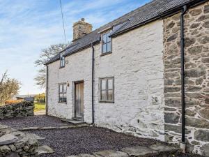 an old stone cottage with a brick building at 3 Bed in Bala 91365 in Bala