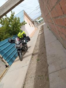 a motorcycle parked on the side of a sidewalk at Ariel in Gobernador Gregores