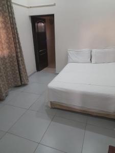 Un pat sau paturi într-o cameră la Chidenguele