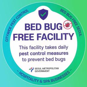 a sign that reads bed bug free facility at JD Tower Hotel in Seoul