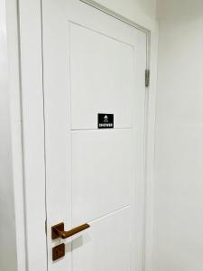 a white door with a sign on it at Studio 12 in London