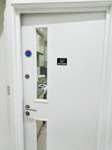 a door with a sticker on it with a mirror at Studio 12 in London