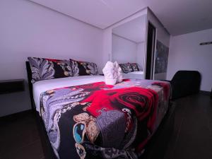 a bedroom with a bed with an elephant blanket at Dubai vip in Bogotá