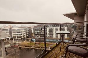 a balcony with a view of a city at Deluxe City Apt, River Canal View& Free Parking! in Leeds