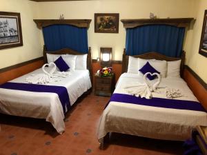 Postel nebo postele na pokoji v ubytování Hotel Tradicional