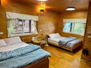 Postel nebo postele na pokoji v ubytování Lala Mountain San hao Manor