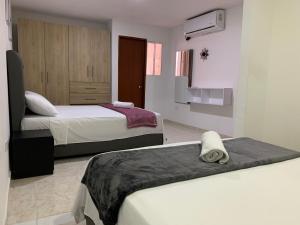 Ένα ή περισσότερα κρεβάτια σε δωμάτιο στο BH Di Apartment