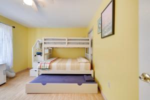 a bedroom with two bunk beds in a room at Zen Den - Pocono LakeFront with Hot Tub ! in Pocono Summit