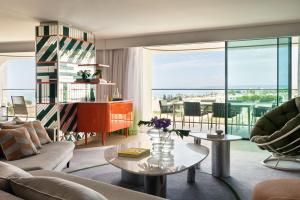 a living room with a couch and a table at W Residences Algarve in Albufeira