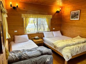 Postel nebo postele na pokoji v ubytování Lala Mountain San hao Manor