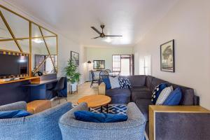a living room with a couch and a table at Ocean Villa in Durban
