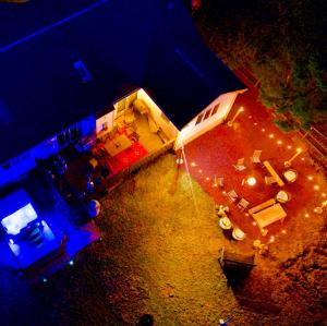 an overhead view of a house with lights on it at Zen Den - Pocono LakeFront with Hot Tub ! in Pocono Summit