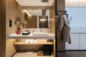 Vannituba majutusasutuses Paco Hotel Botanical Garden Metro Guangzhou-Free Shuttle Bus For Canton Fair