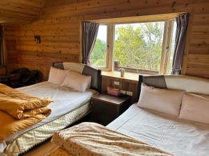 Postel nebo postele na pokoji v ubytování Lala Mountain San hao Manor
