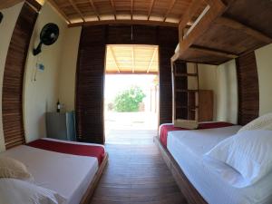 Postel nebo postele na pokoji v ubytování Ecorali Lodge