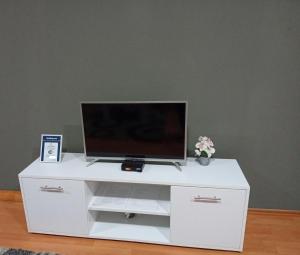 a white entertainment center with a flat screen tv on it at Apartmani Lazaro in Višegrad