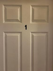 a door with the number on it at Premium home with Garden view, private parking in Toronto