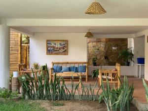 a living room with a couch and a table at Terraza Salvatore, Casa en Las Pocitas de Máncora in Máncora