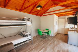a room with two bunk beds and a table at Eaglehawk Park Canberra in Canberra