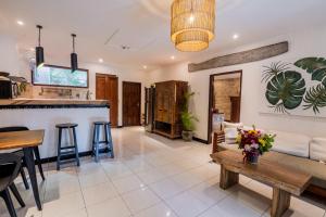 a living room with a couch and a table at Peaceful Tranquil Villa in Nusa Dua in Nusa Dua