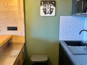 a kitchen with a sink and a counter top at Studio ski aux pieds avec balcon et fibre, 5 pers - FR-1-346-555 in Arc 1800 +2 photos