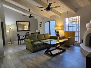 a living room with a couch and a table at A Few Steps To Heated Pool, Tennis, Bike Trail in Scottsdale
