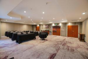 a large room with tables and chairs and a podium at Courtyard Ventura Simi Valley in Simi Valley