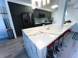 a kitchen with a large white counter in a room at Amazing Large 2 Bedroom West Hollywood Apartment in Los Angeles