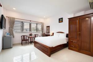 Ένα ή περισσότερα κρεβάτια σε δωμάτιο στο Hoang Hoang Hotel (Bloom 3)