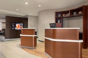 a lobby with a reception desk in a hospital at Courtyard By Marriott Las Vegas Stadium Area in Las Vegas
