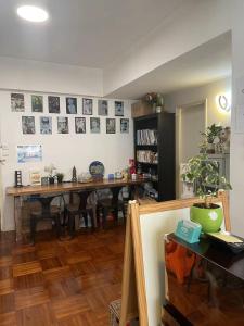 a dining room with a wooden table and a dining room at Timehouse Hong Kong Hostel Group in Hong Kong
