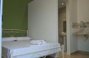 Postel nebo postele na pokoji v ubytování Markora Rooms