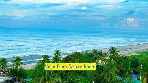 a view of the beach from the balcony of a resort at Modern Resort in Cox's Bazar