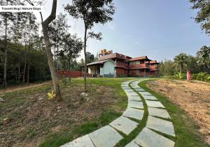 a walkway in front of a house at Pepper Corn Retreat by Travent Mug in Sakleshpur