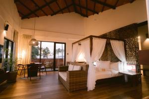 Letto o letti in una camera di Nacpan Beach Resort Managed by H Hospitality Group