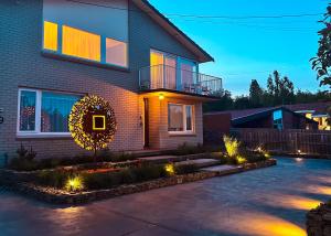 a house with a wreath on the front of it at Hobart Avenue Apartment The Residence in Sandy Bay