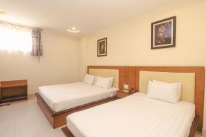 Postel nebo postele na pokoji v ubytování Song Anh 3 Hotel