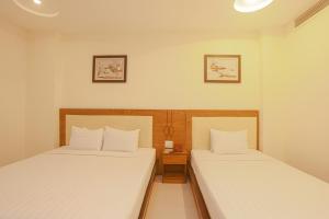 Postel nebo postele na pokoji v ubytování Song Anh 3 Hotel